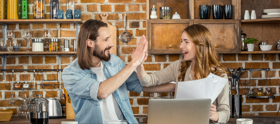 young couple business owners smiling